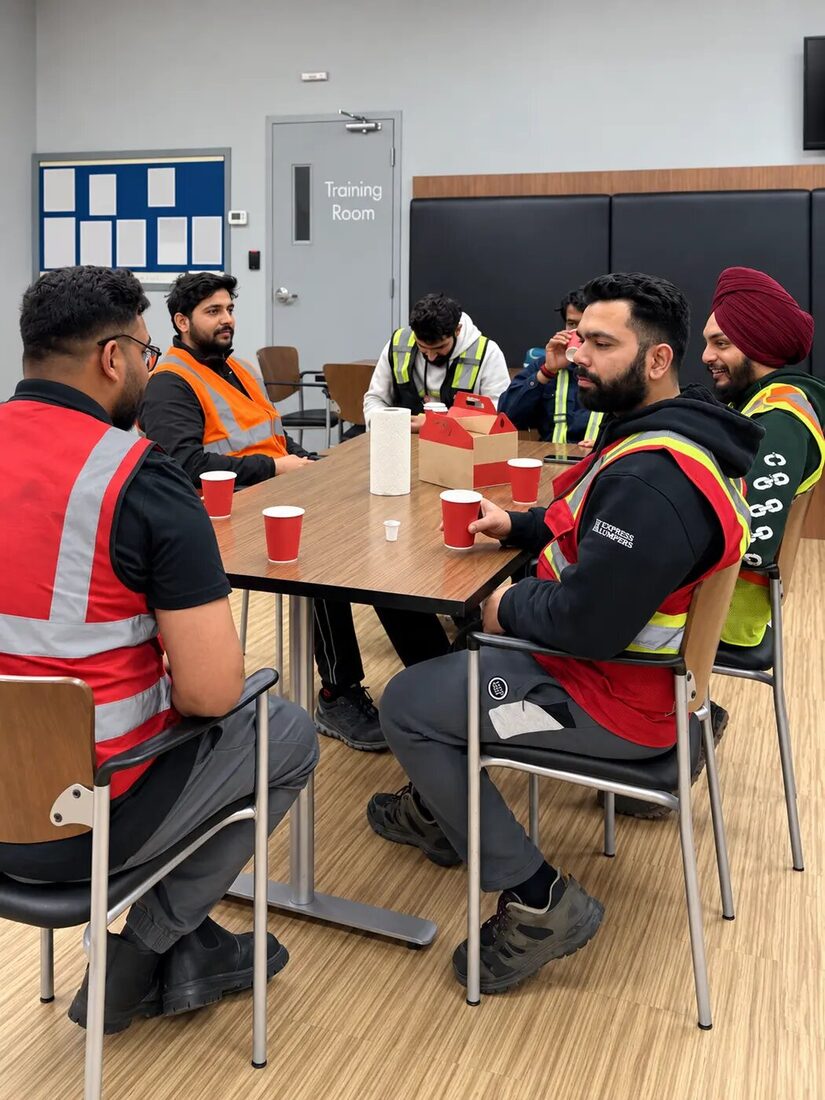 Express Lumpers Alberta warehouse team gathered in a training room