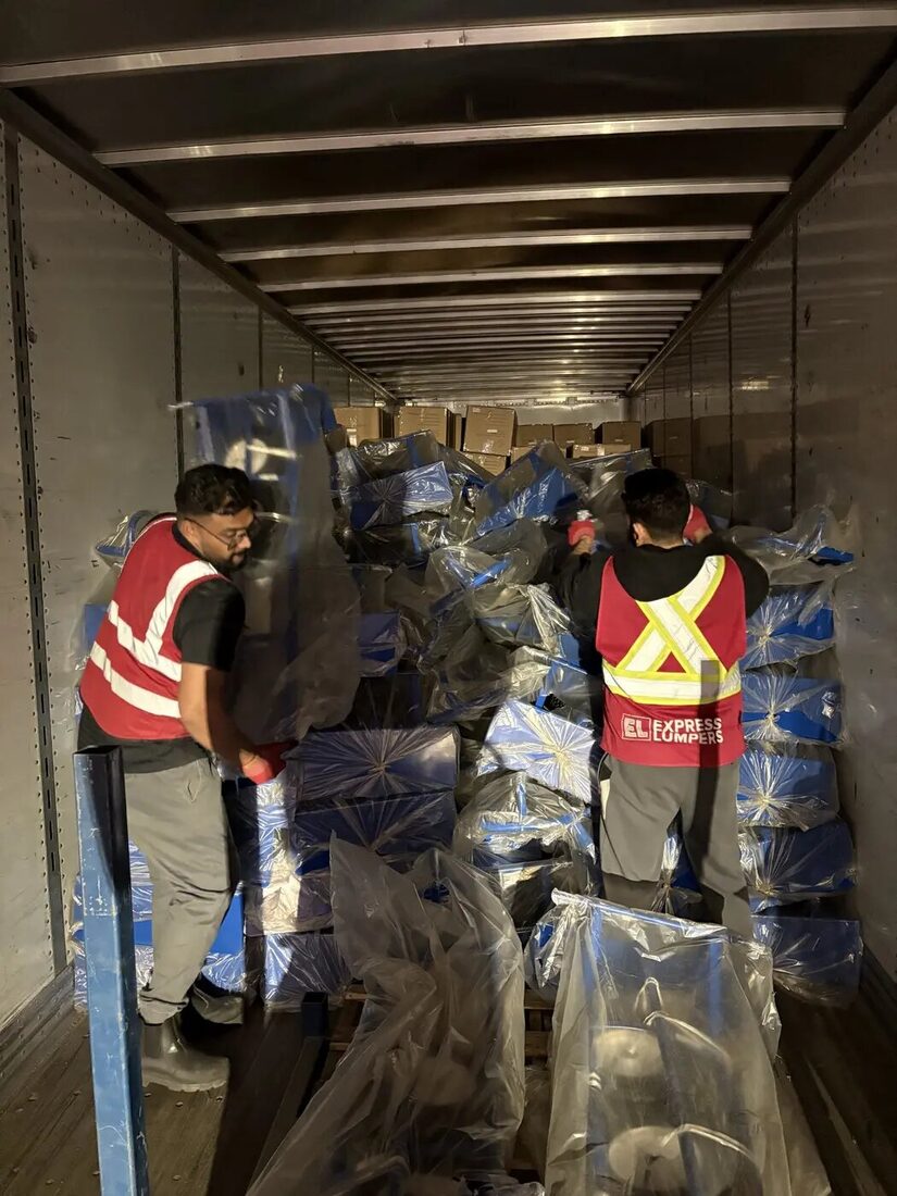 Express Lumpers crew handling non-standard floor-loaded freight in Alberta
