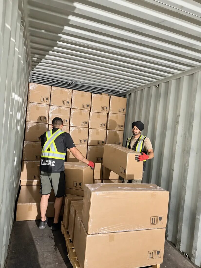 Express Lumpers crew unloading cartons as part of an Alberta container program