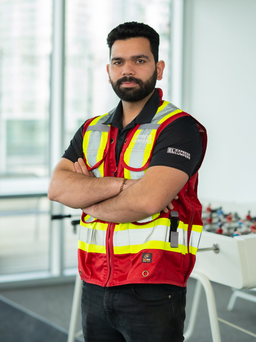 An Express Lumpers team member in branded safety gear