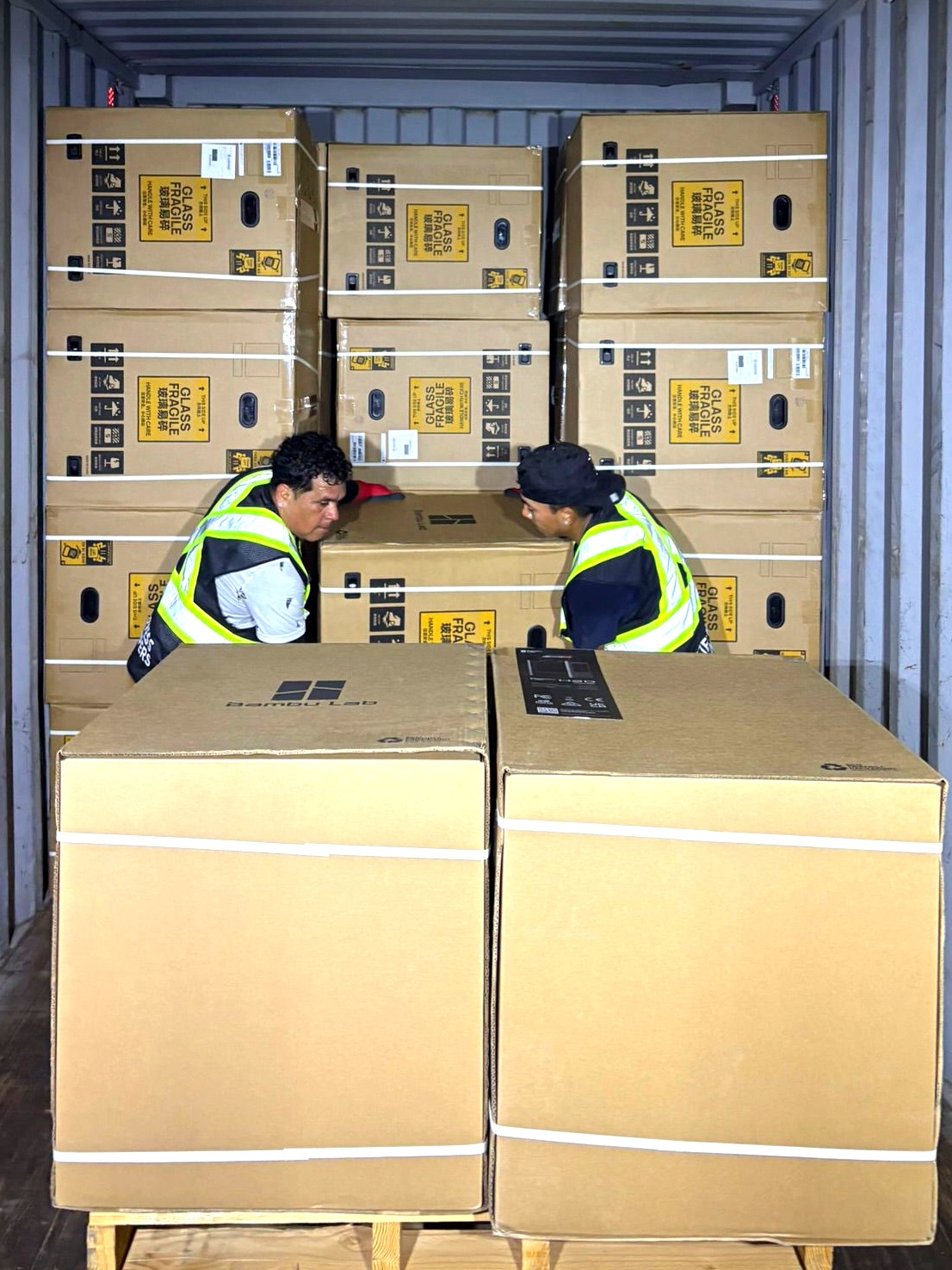 Express Lumpers crew handling freight inside a shipping container